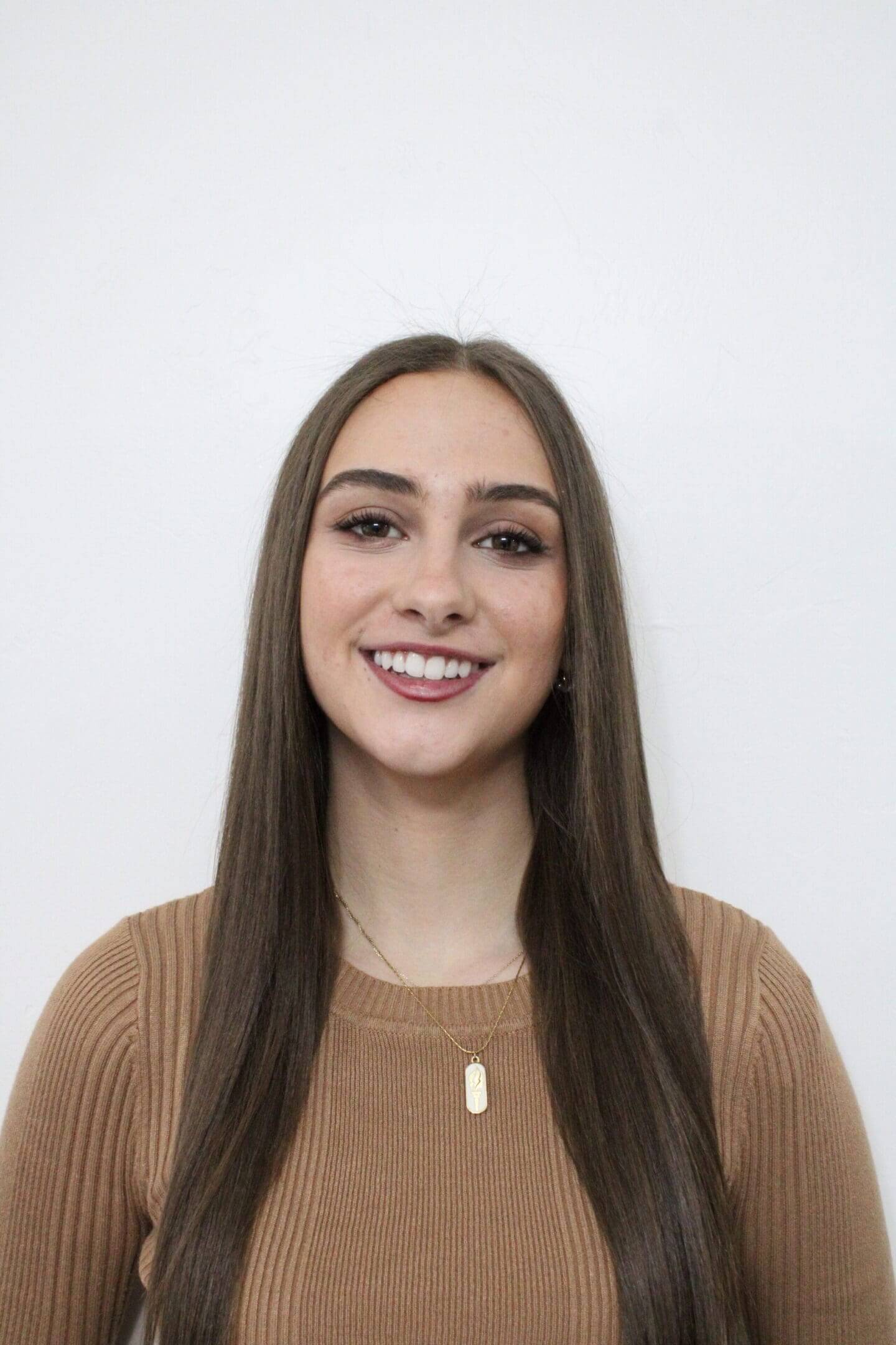 Smiling woman with long straight hair